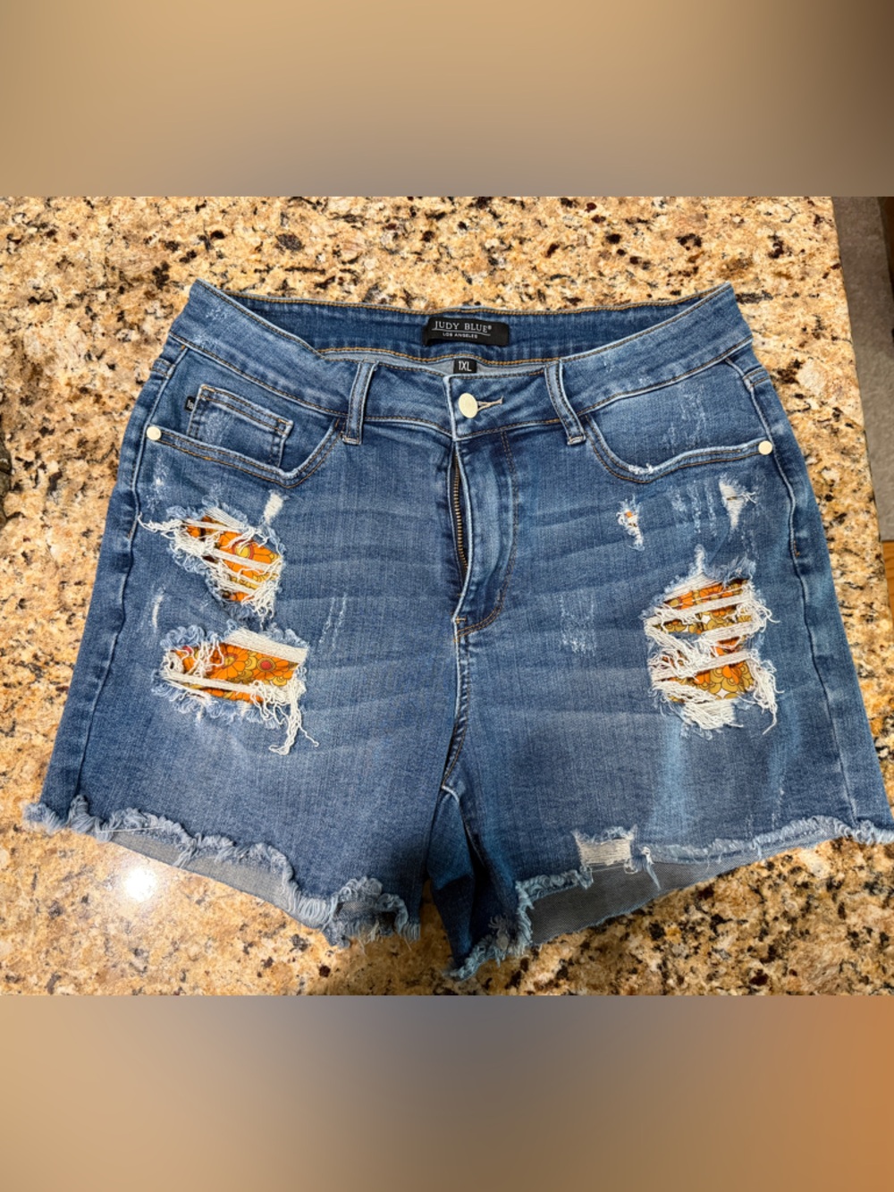 Judy Blue 4” high rise distressed blue denim shorts with orange retro accents